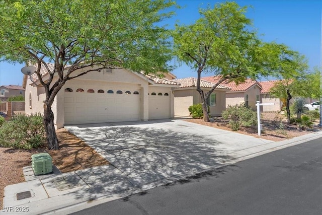 4029 Ricebird Way N, Las Vegas, NV 89084 - mediterranean / spanish home with an attached garage, stucco siding, concrete driveway, and a tiled roof