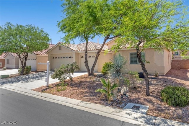 4029 Ricebird Way N, Las Vegas, NV 89084 - view of front of house with a garage, stucco siding, concrete driveway, and a tile roof