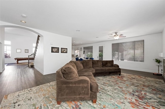 2229 Armacost Dr, Henderson, NV 89074 - living room with arched walkways, wood finished floors, ceiling fan, recessed lighting, and stairway