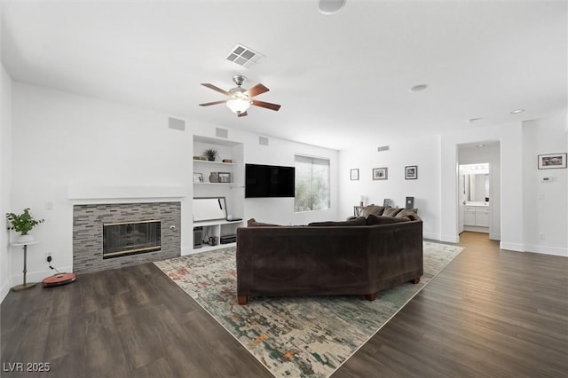 2229 Armacost Dr, Henderson, NV 89074 - living room featuring wood finished floors, a ceiling fan, and a tile fireplace
