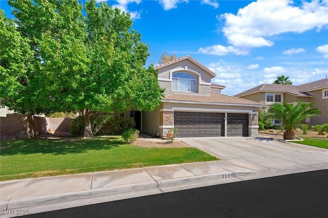 2229 Armacost Dr, Henderson, NV 89074 - view of front of house featuring stucco siding, stone siding, driveway, and a front yard