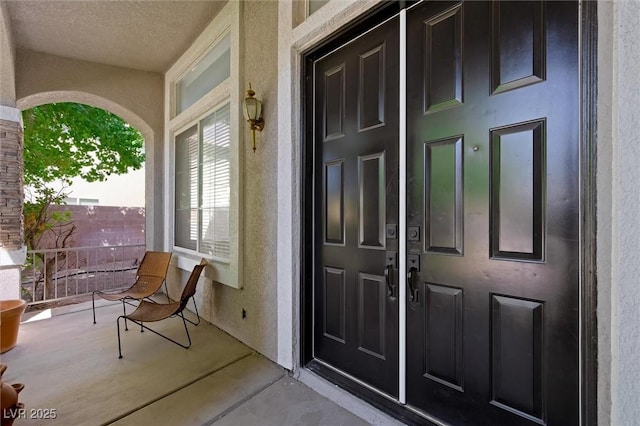 2229 Armacost Dr, Henderson, NV 89074 - view of exterior entry featuring stucco siding and a porch