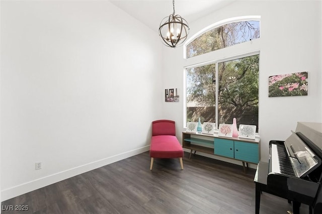 2229 Armacost Dr, Henderson, NV 89074 - sitting room with a chandelier, dark wood-style flooring, and a towering ceiling