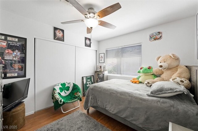 2229 Armacost Dr, Henderson, NV 89074 - bedroom featuring wood finished floors, a closet, and a ceiling fan