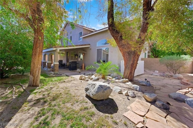 2229 Armacost Dr, Henderson, NV 89074 - rear view of property with a patio and stucco siding
