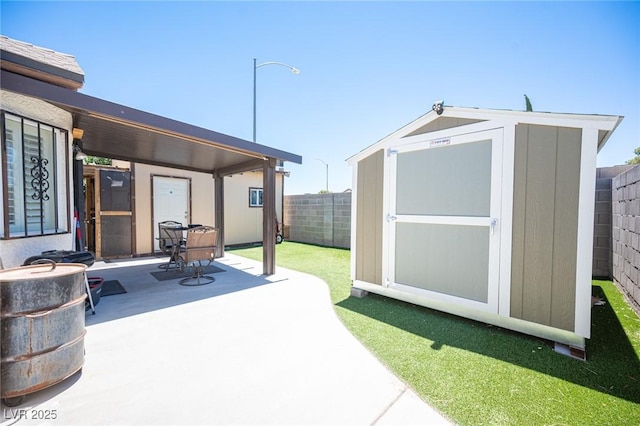 7231 Sequoia Springs Dr, Las Vegas, NV 89147 - fenced backyard featuring a storage shed and a patio