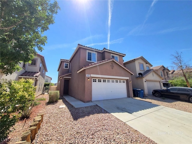 9530 Windsor Forest Ct, Las Vegas, NV 89123 - view of front of house featuring stucco siding, a tile roof, concrete driveway, and a garage