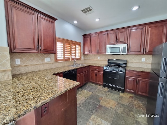 9530 Windsor Forest Ct, Las Vegas, NV 89123 - kitchen featuring black appliances, dark brown cabinets, light stone counters, tasteful backsplash, and recessed lighting