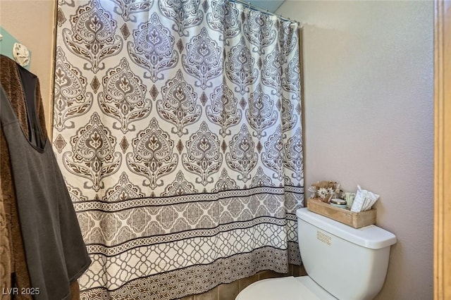 6616 Celeste Ave, Las Vegas, NV 89107 - bathroom with toilet and curtained shower