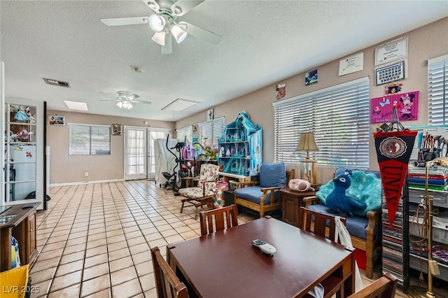 6616 Celeste Ave, Las Vegas, NV 89107 - tiled dining room featuring ceiling fan and a textured ceiling