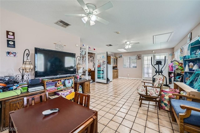 6616 Celeste Ave, Las Vegas, NV 89107 - living area with attic access, ceiling fan, and light tile patterned floors
