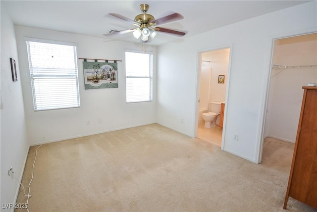 6098 Darkfeather Way, Las Vegas, NV 89139 - unfurnished bedroom featuring a spacious closet, carpet flooring, a closet, ensuite bath, and ceiling fan