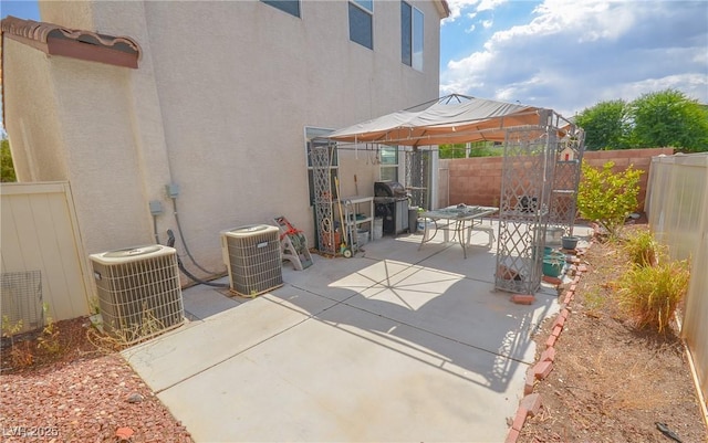 6098 Darkfeather Way, Las Vegas, NV 89139 - fenced backyard with a gazebo, a patio area, and a grill