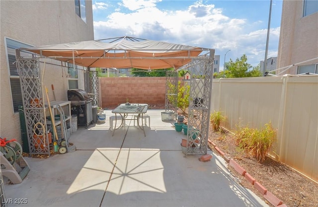 6098 Darkfeather Way, Las Vegas, NV 89139 - fenced backyard featuring a patio, grilling area, and a gazebo