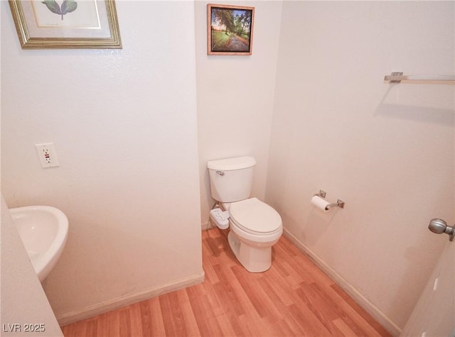 6098 Darkfeather Way, Las Vegas, NV 89139 - bathroom with wood finished floors and toilet
