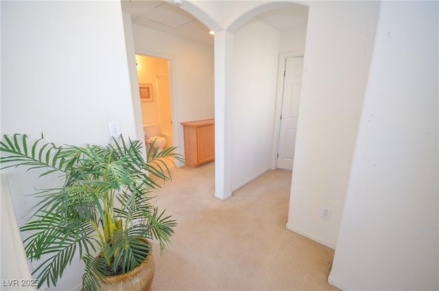 6098 Darkfeather Way, Las Vegas, NV 89139 - corridor featuring light carpet and arched walkways