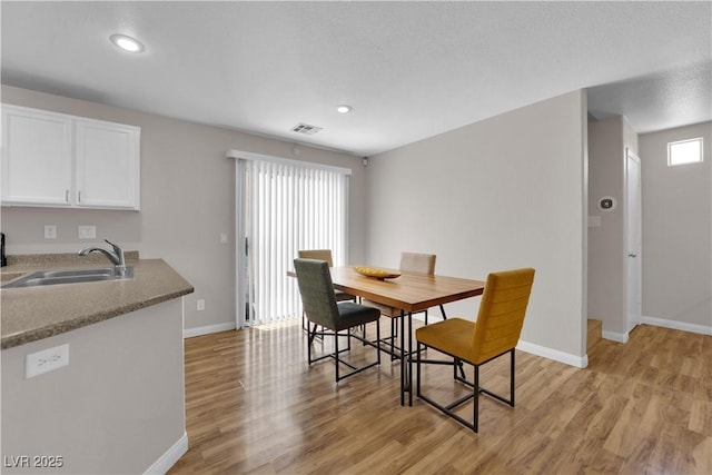 9957 Fine Fern St, Las Vegas, NV 89183 - dining room featuring light wood-style flooring and recessed lighting