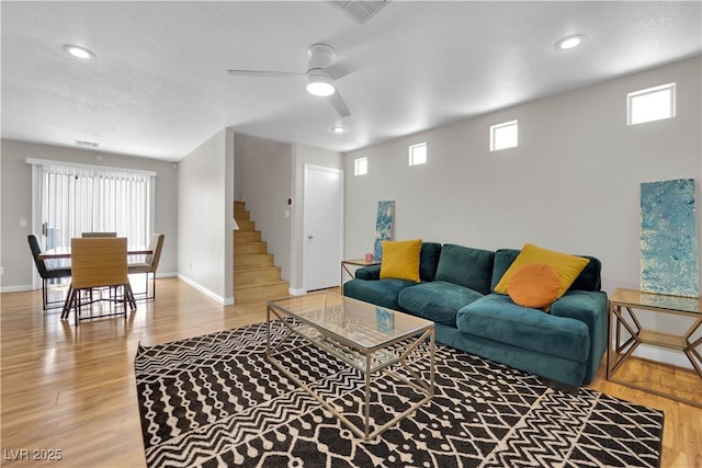 9957 Fine Fern St, Las Vegas, NV 89183 - living room featuring wood finished floors, ceiling fan, stairway, and recessed lighting
