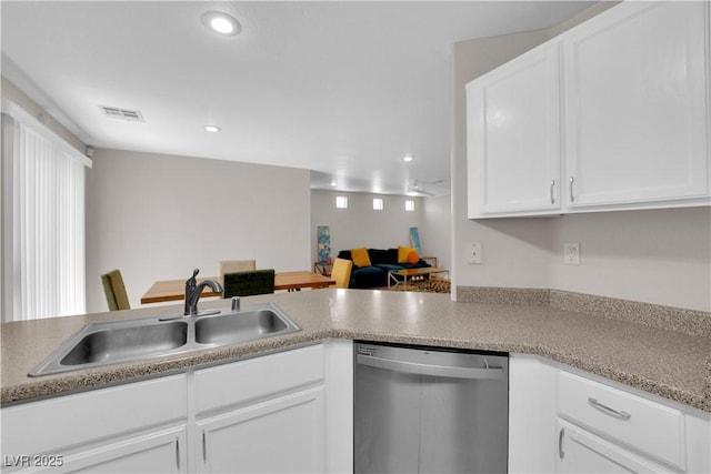 9957 Fine Fern St, Las Vegas, NV 89183 - kitchen featuring stainless steel dishwasher, white cabinets, recessed lighting, and light countertops