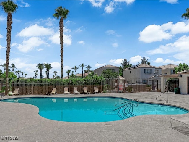 9957 Fine Fern St, Las Vegas, NV 89183 - community pool with a patio area and a residential view