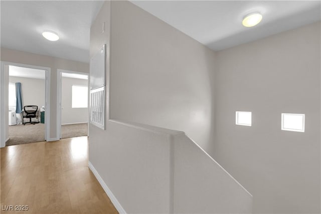 9957 Fine Fern St, Las Vegas, NV 89183 - hall with light wood-type flooring and an upstairs landing