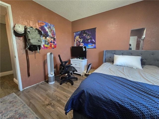 4823 El Tesoro Ave, Las Vegas, NV 89121 - bedroom featuring wood finished floors and a textured ceiling