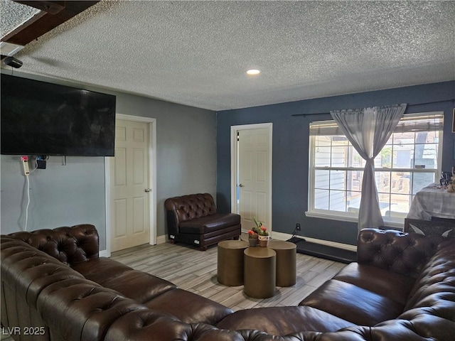 4823 El Tesoro Ave, Las Vegas, NV 89121 - living room with wood finished floors, a textured ceiling, and recessed lighting