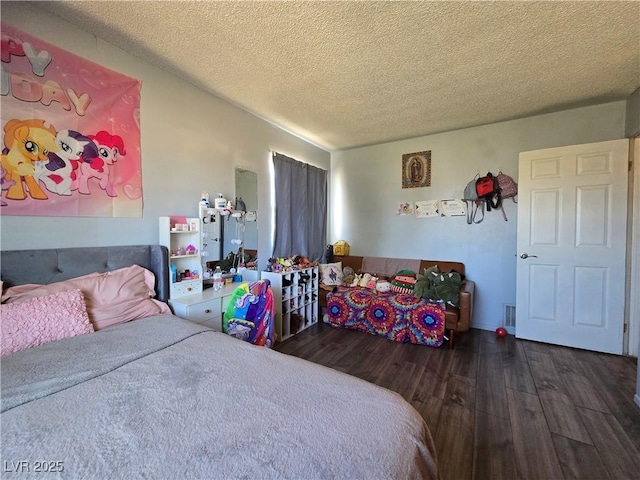 4823 El Tesoro Ave, Las Vegas, NV 89121 - bedroom featuring wood finished floors and a textured ceiling