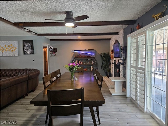 4823 El Tesoro Ave, Las Vegas, NV 89121 - dining room with a textured ceiling, healthy amount of natural light, a ceiling fan, beam ceiling, and light wood-style floors