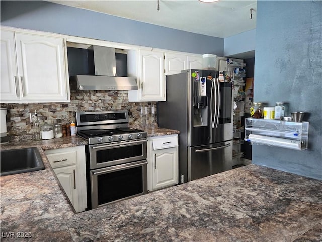 4823 El Tesoro Ave, Las Vegas, NV 89121 - kitchen featuring stainless steel appliances, wall chimney exhaust hood, backsplash, and white cabinetry