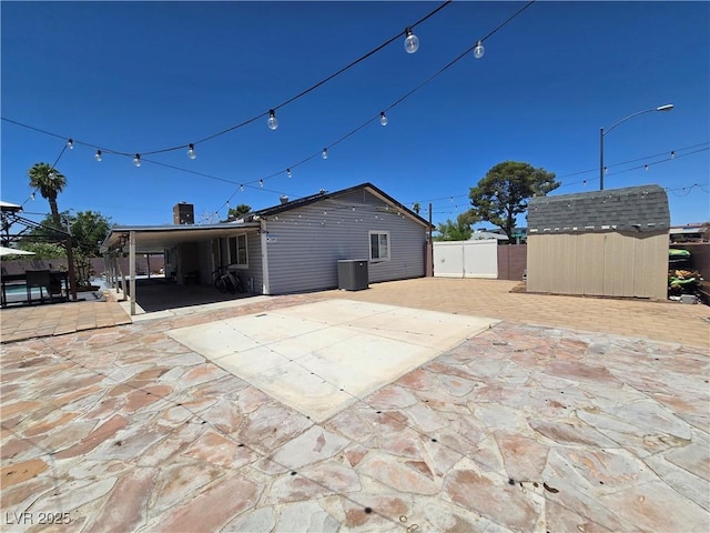 4823 El Tesoro Ave, Las Vegas, NV 89121 - back of house featuring a storage unit