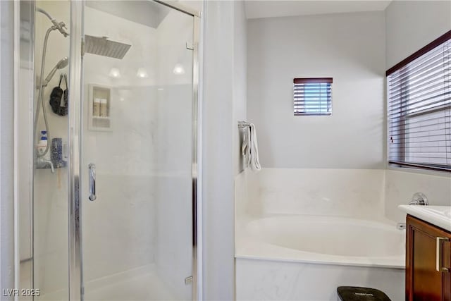 9864 Maspalomas St, Las Vegas, NV 89178 - bathroom featuring a stall shower, a garden tub, and vanity