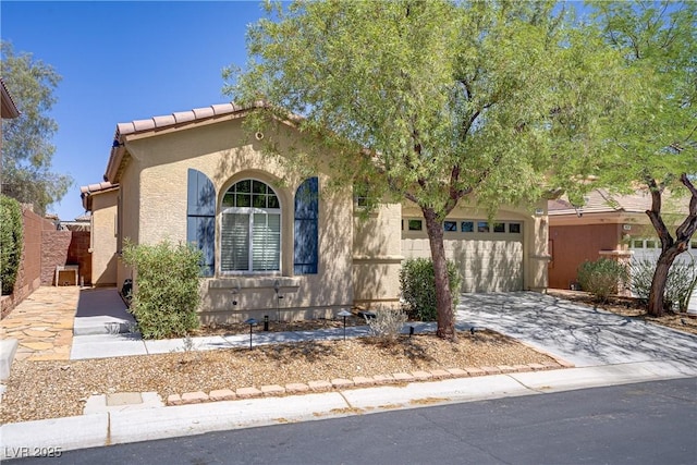 9864 Maspalomas St, Las Vegas, NV 89178 - view of front of house featuring stucco siding, concrete driveway, an attached garage, and a tile roof
