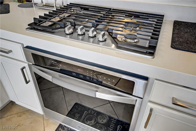 9864 Maspalomas St, Las Vegas, NV 89178 - kitchen view of appliances with stainless steel finishes and white cabinets