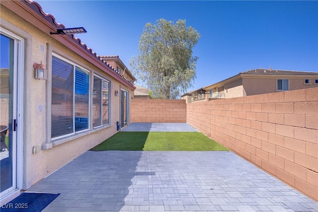 9864 Maspalomas St, Las Vegas, NV 89178 - fenced backyard with a patio area