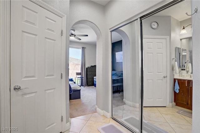 9864 Maspalomas St, Las Vegas, NV 89178 - ensuite bathroom featuring vanity, tile patterned floors, and a ceiling fan