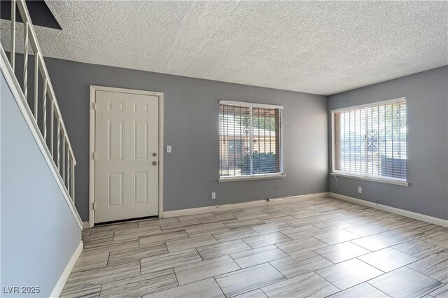 1372 Lorilyn Ave Unit 3, Las Vegas, NV 89119 - foyer with stairs and a textured ceiling