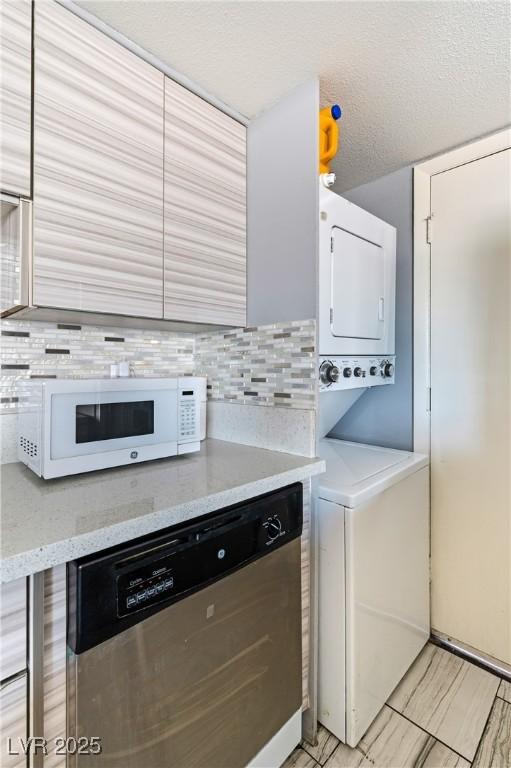 1372 Lorilyn Ave Unit 3, Las Vegas, NV 89119 - laundry area with estacked washer and dryer