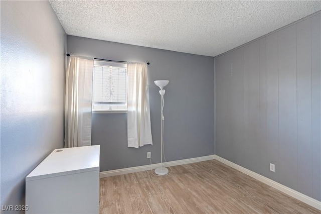 1372 Lorilyn Ave Unit 3, Las Vegas, NV 89119 - empty room with light wood finished floors and a textured ceiling