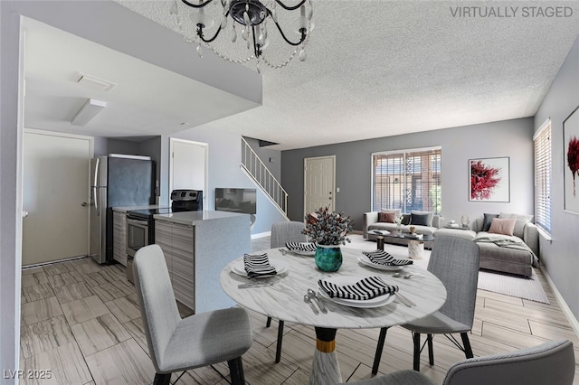 1372 Lorilyn Ave Unit 3, Las Vegas, NV 89119 - dining space featuring stairway, a chandelier, and a textured ceiling