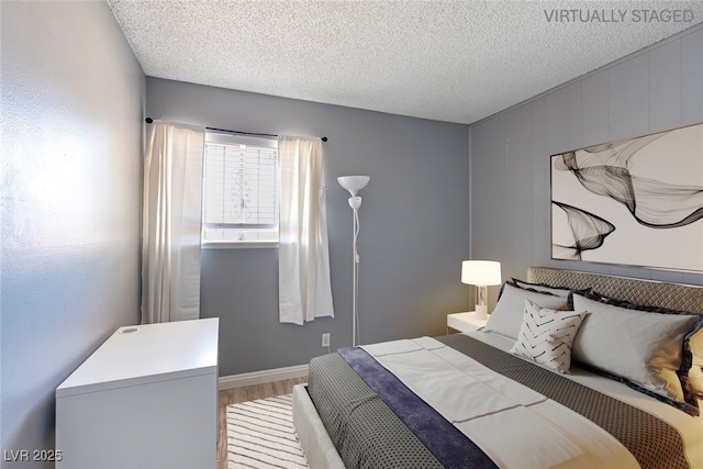 1372 Lorilyn Ave Unit 3, Las Vegas, NV 89119 - bedroom featuring wood finished floors and a textured ceiling
