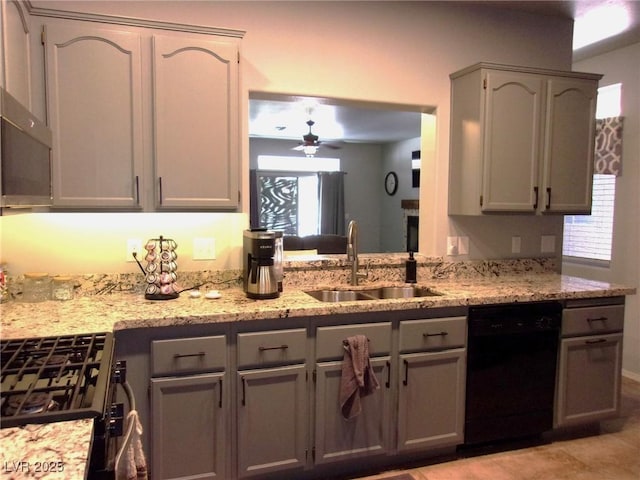 3337 Partridge Run St, Laughlin, NV 89029 - kitchen with dishwasher, range with gas cooktop, light stone counters, a ceiling fan, and gray cabinets