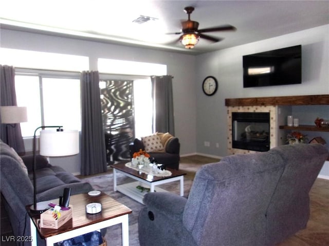 3337 Partridge Run St, Laughlin, NV 89029 - living room featuring a tile fireplace and ceiling fan