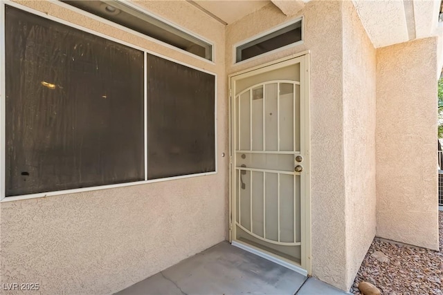 3337 Partridge Run St, Laughlin, NV 89029 - doorway to property featuring stucco siding