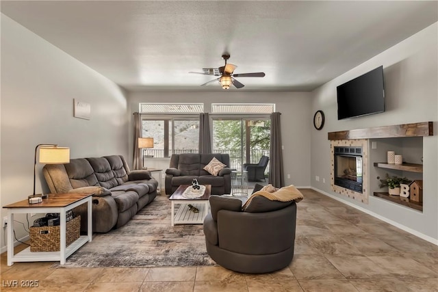 3337 Partridge Run St, Laughlin, NV 89029 - tiled living room featuring a ceiling fan and a tile fireplace