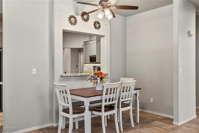 3337 Partridge Run St, Laughlin, NV 89029 - dining space featuring ceiling fan and baseboards