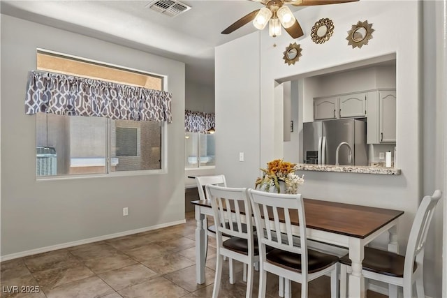3337 Partridge Run St, Laughlin, NV 89029 - tiled dining space featuring a ceiling fan and baseboards