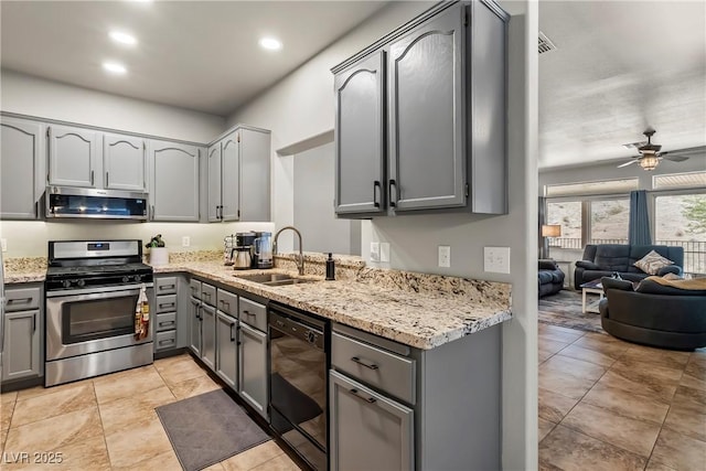 3337 Partridge Run St, Laughlin, NV 89029 - kitchen featuring stainless steel appliances, gray cabinets, light stone countertops, a ceiling fan, and recessed lighting