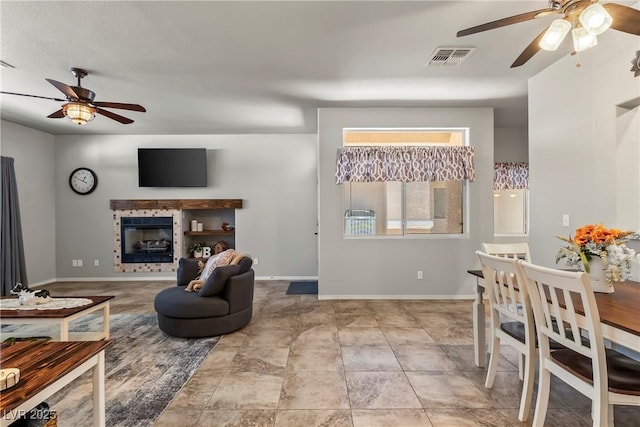 3337 Partridge Run St, Laughlin, NV 89029 - living room with ceiling fan and a tile fireplace