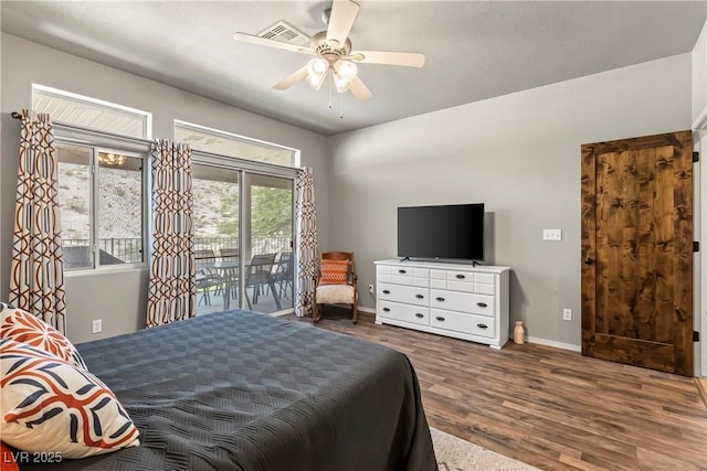 3337 Partridge Run St, Laughlin, NV 89029 - bedroom with access to exterior, wood finished floors, and a ceiling fan